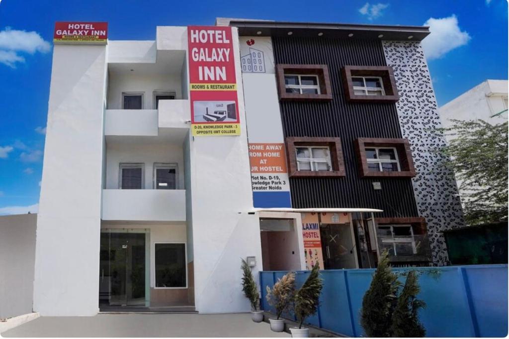 a building with signs in front of it at Hotel Galaxy Inn in Greater Noida