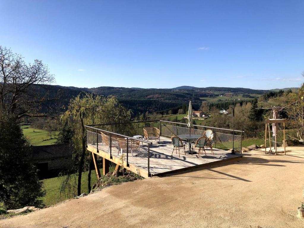 a deck with some animals sitting on top of it at La Pousterle - Gîte in Salettes