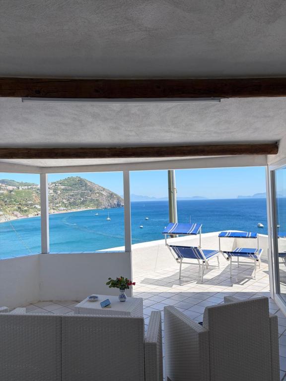 a view of the ocean from the balcony of a house at Villa Egidio Terrazza in Sant'Angelo D'Ischia