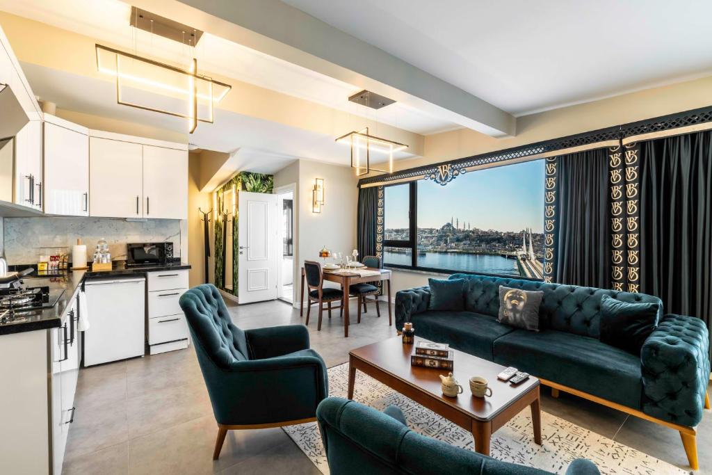 a living room with a couch and a table at Bellavia Deluxe Apart in Istanbul