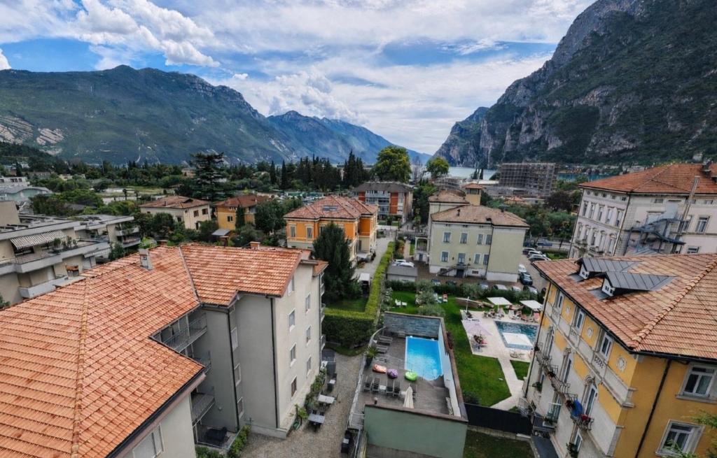 a view of a town with mountains in the background at Residence Alle Palme in Riva del Garda