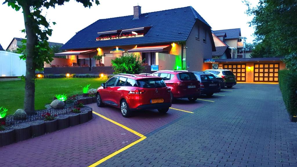 a group of cars parked in front of a building at CariSSA Ferienwohnung - mit THERMEplus in Bad Bevensen