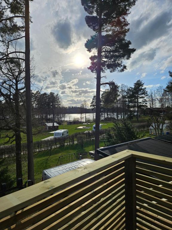 a view of a golf course from a wooden deck at Klevenius in Gnesta