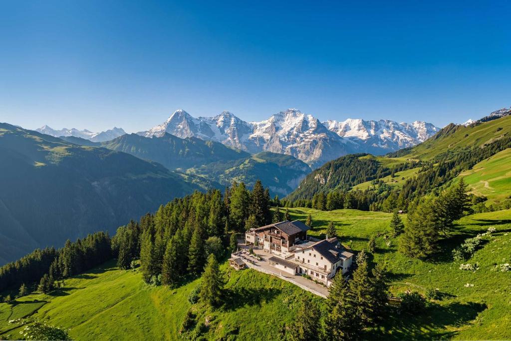an aerial view of a house in the mountains at Waldhotel Fletschhorn Private Whole Hotel in Saas-Fee 360 Alpine Views & Sauna in Saas-Fee