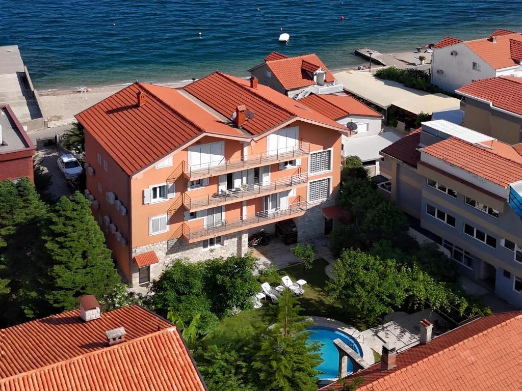 an aerial view of a building and the ocean at Apartment Orange Blossom First Line & Pool 2 in Bijela