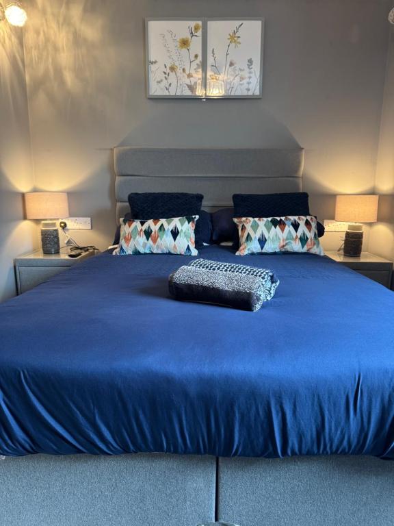 a blue bed with a keyboard on top of it at The Milton Accommodation in Elgin