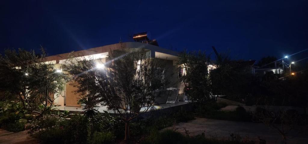 a house with lights on it at night at Rey Garden 2 in Vlorë