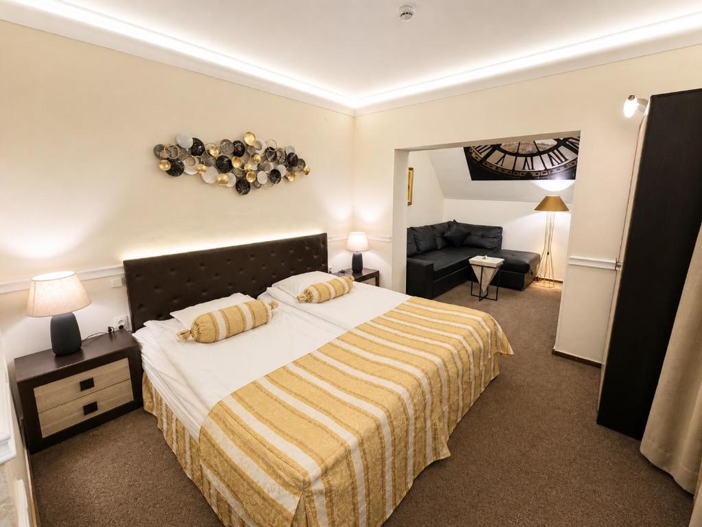 a bedroom with a bed and a living room at Hotel Cheap - Smart choice - Great value in Sofia