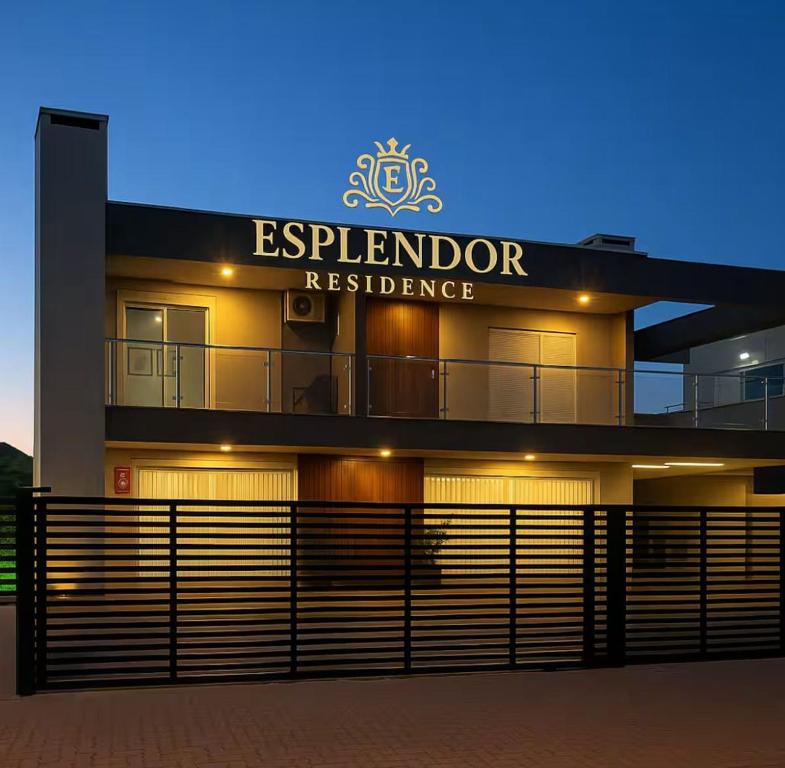 a building with a sign that reads esplanario residence at Esplendor Residence Seu Paraíso em Atlântida com Piscina in Xangri-lá