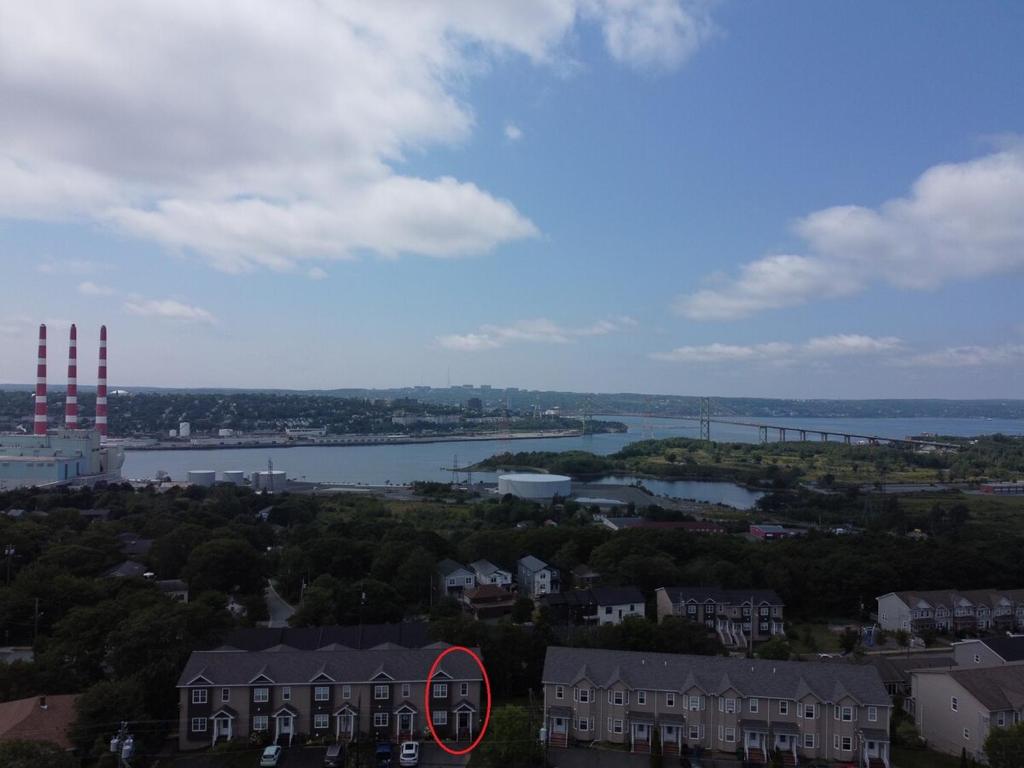a view of a city with a river and buildings at Studio Guest Apartment in Dartmouth in Halifax