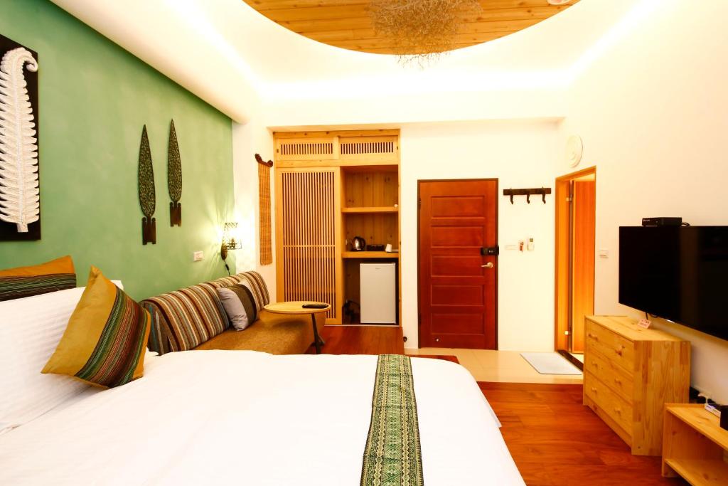 Postel nebo postele na pokoji v ubytování Tang Chao B&B