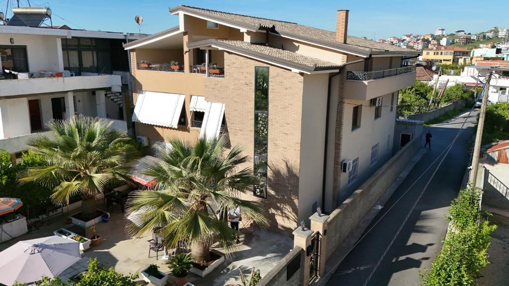 an aerial view of a house with palm trees at Villa Hoxha 80 in Durrës