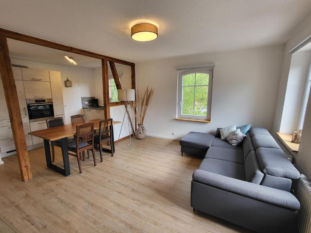 a living room with a couch and a table at Schwarzwaldblick in Schramberg