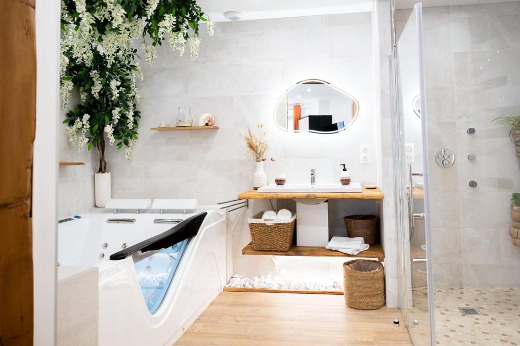 a bathroom with a sink and a shower at L'Escapade Etoilée Rosheim in Rosheim