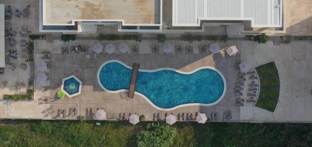 an aerial view of a swimming pool in a resort at Swiss Apartments 3 in Velika Plaža