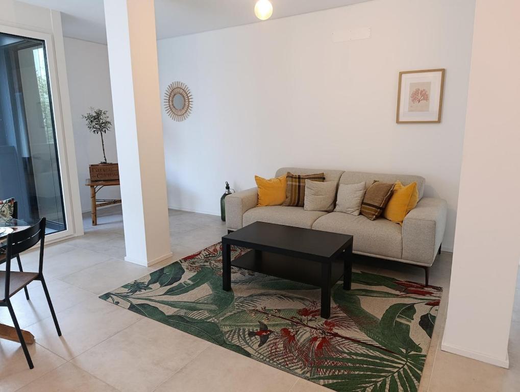 a living room with a couch and a table at Funicolare 64 in Paradiso