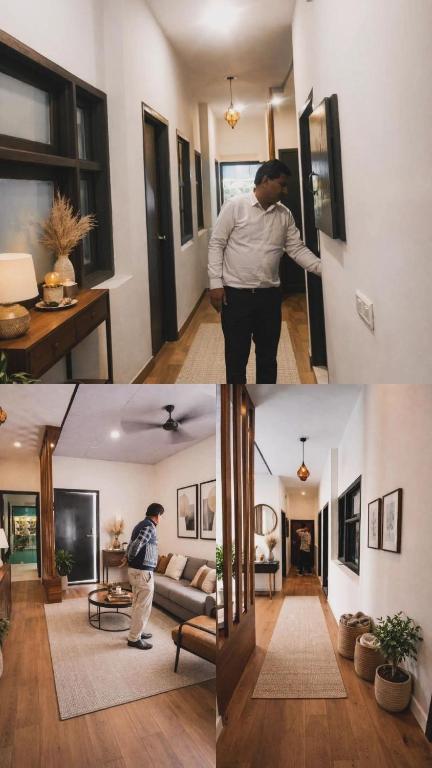 a man is standing in a living room at BTL Kamakshi homez , 3bhk free parking, open dining, balcony in Ludhiana