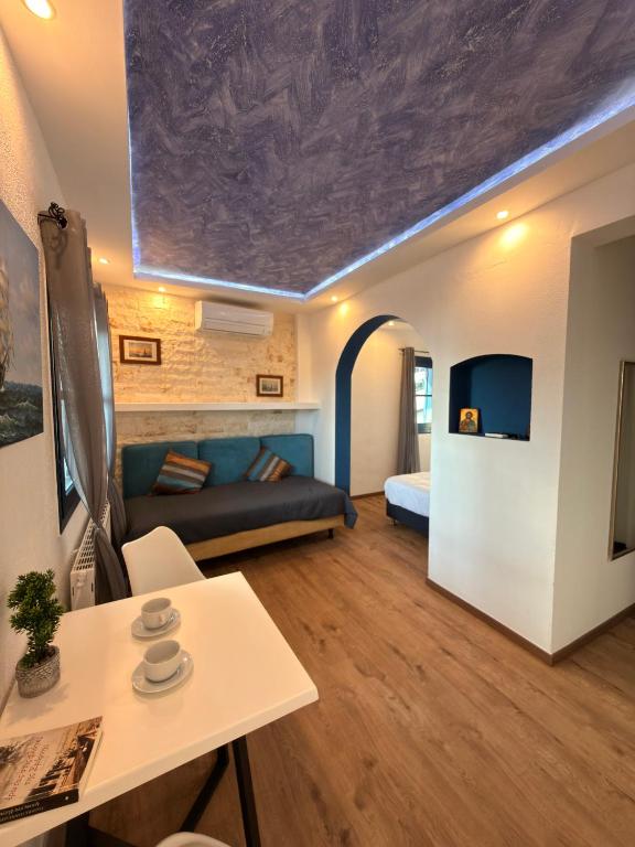 a living room with a couch and a table at Archontarikia Luxury in Ouranoupoli