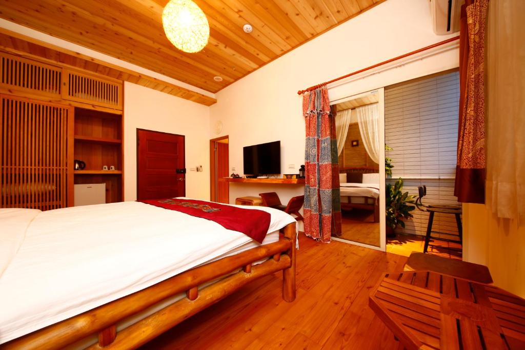 Postel nebo postele na pokoji v ubytování Shang Shui Yun Ji B&B