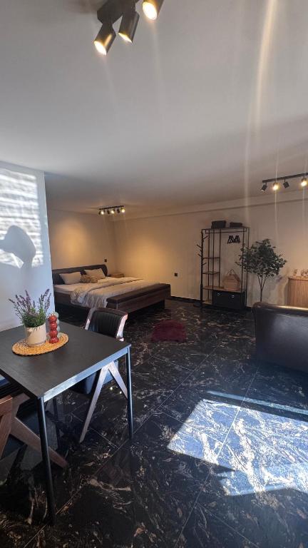a living room with a bed and a table at My Wellness Ferienwohnung in Bullay