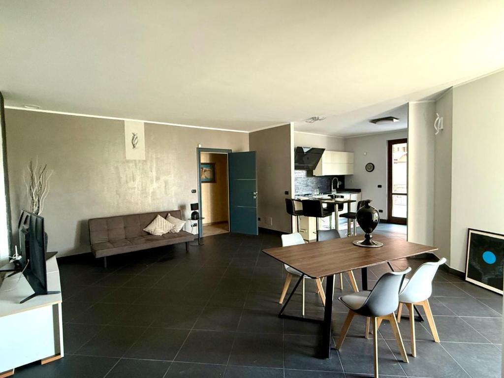 a living room with a table and a couch at Ca Rene in Savigliano