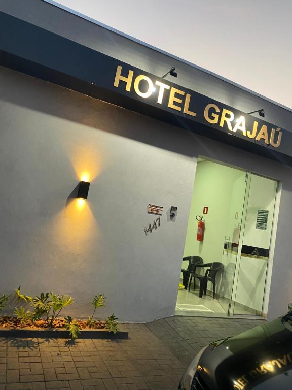 a hotel grille with a sign on the side of a building at Hotel Grajaú in Arcos