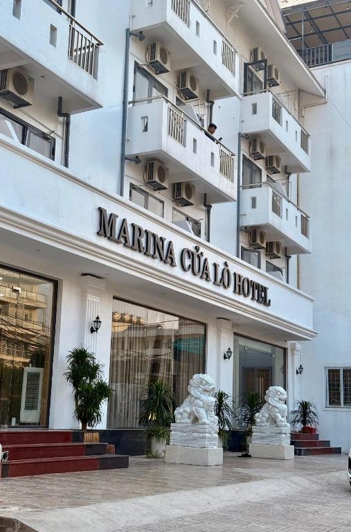 a building with a sign that reads mainma cilia colico hotel at Marina Cua Lo Hotel in Cửa Lô