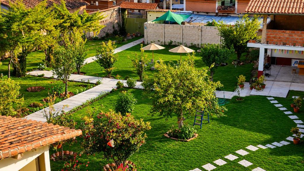 an aerial view of a garden with trees and umbrellas at Chaska Valle Green in Urubamba
