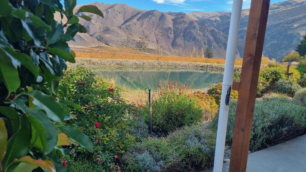 a view of a lake with mountains in the background at Lodges On Pearson Unit 1 in Cromwell
