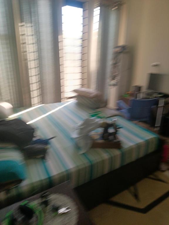 a blurry picture of a living room with a table at The 430 Collective in Islamabad