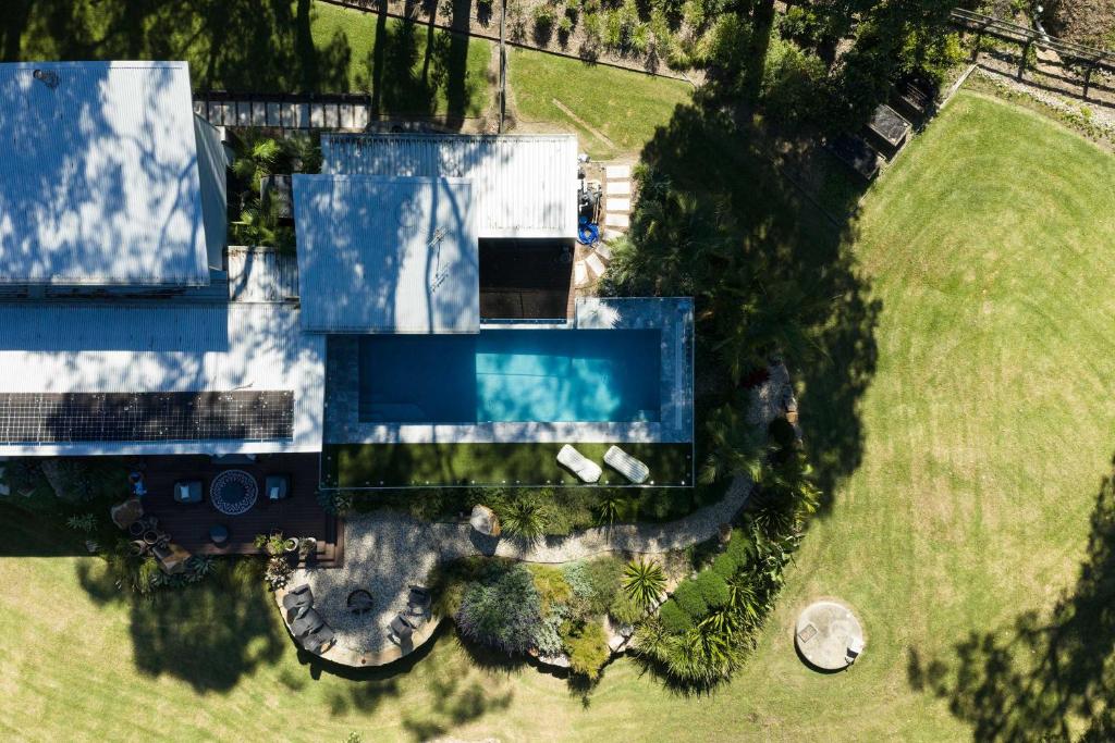 an overhead view of a house with a swimming pool at The Pavilion Wamberal in Wamberal