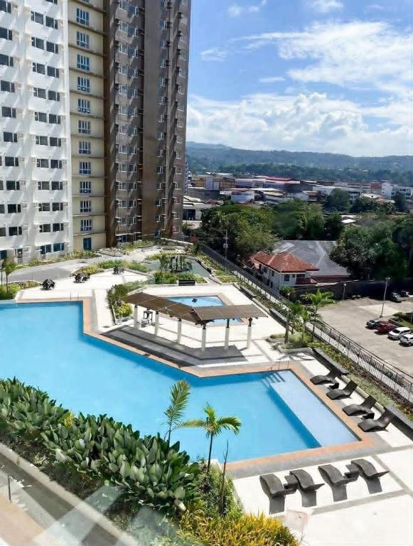 an overhead view of a large swimming pool in a building at AnR Condo at Avida Towers in Cagayan de Oro
