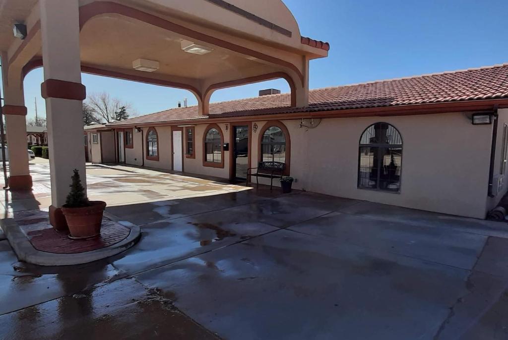 an empty parking lot in front of a building at Travelodge by Wyndham Kanab in Kanab