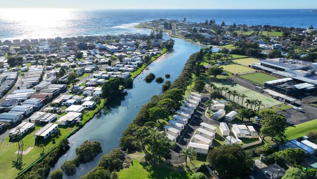an aerial view of a city with a river and houses at Barrack Point Holidays in Barrack Point