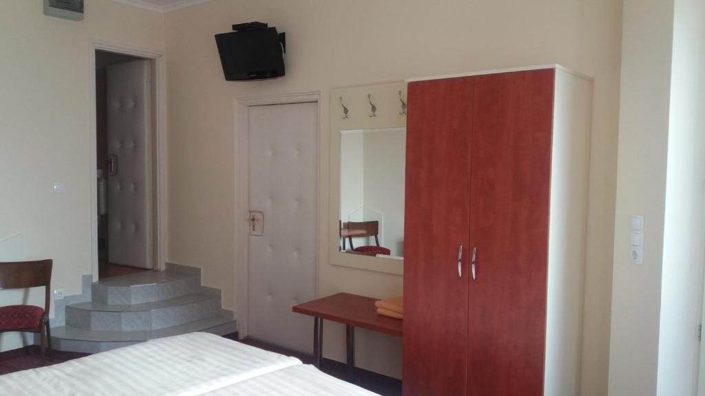 Postel nebo postele na pokoji v ubytování Barokk Antik Guest House