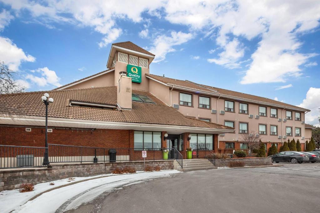 a building with a street sign in front of it at Quality Hotel in Burlington