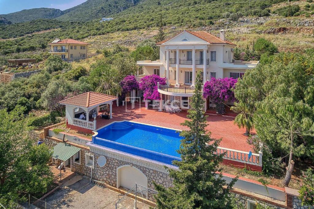 an aerial view of a house with a swimming pool at TEKCE Villa Motto N21 in Kaş