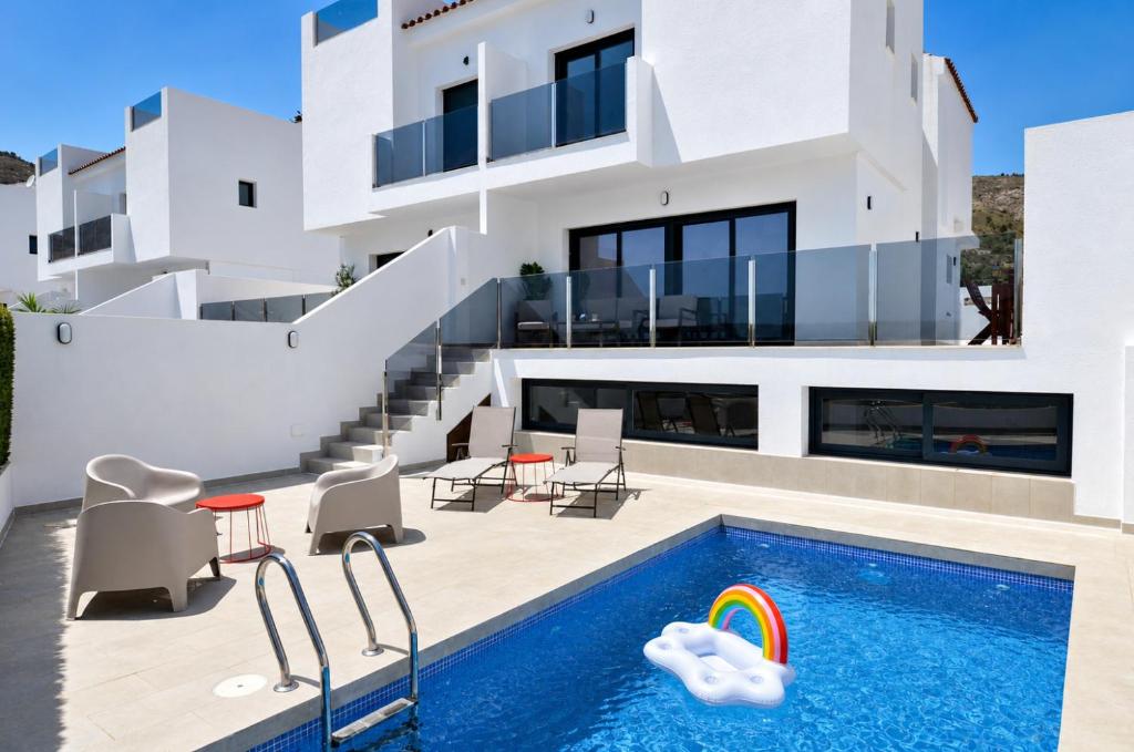 a villa with a swimming pool and a house at Mountain Villa with Pool by NRAS in Orcheta