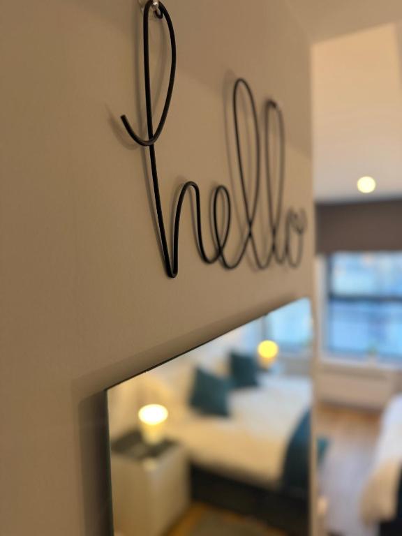a bedroom with a bed and a sign that says no at The Parade, Market Square room 3 in Northampton