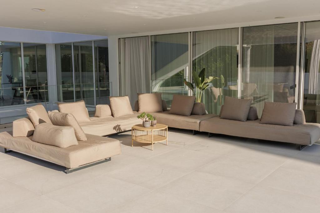 a large living room with couches and a table at Villa Lazareto in Kontokali