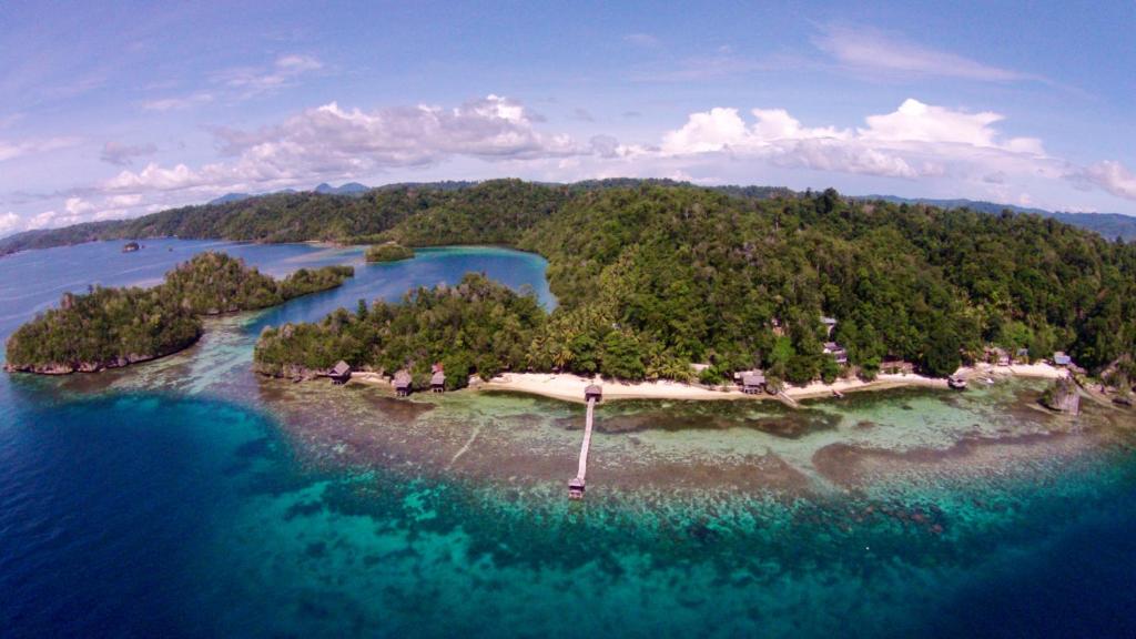 an aerial view of an island in the water at Kadidiri Paradise in Batudaka