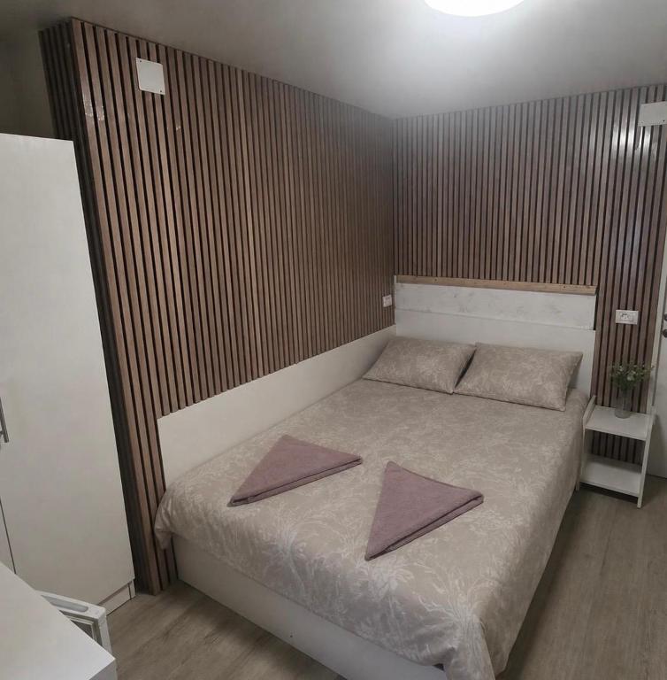 a bedroom with a bed with two mats on it at Casa de Cultura house in Constanţa