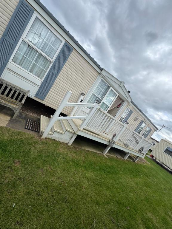 a house with a staircase on the side of it at Home from home in Ingoldmells