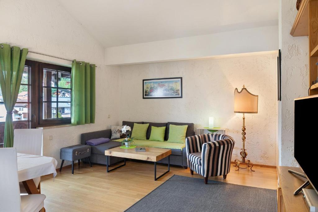 a living room with a couch and a table at Appartement Azalea Oetz in Oetz