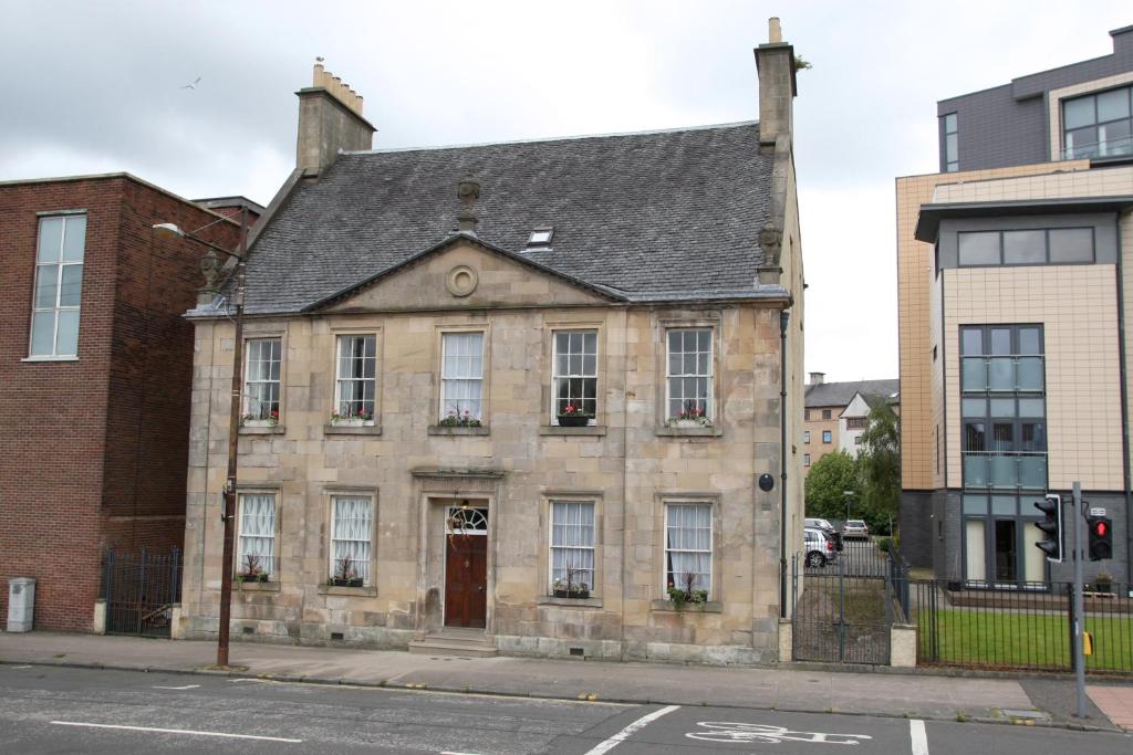 an old stone building on a city street at 52 Charlotte Street , Glasgow green ,City Center in Glasgow