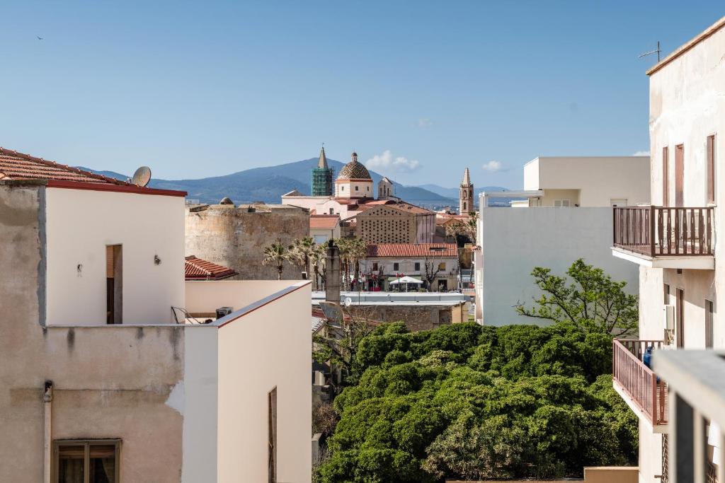 a view of the city from the roofs of buildings at Blue Terrace Guest House in Alghero