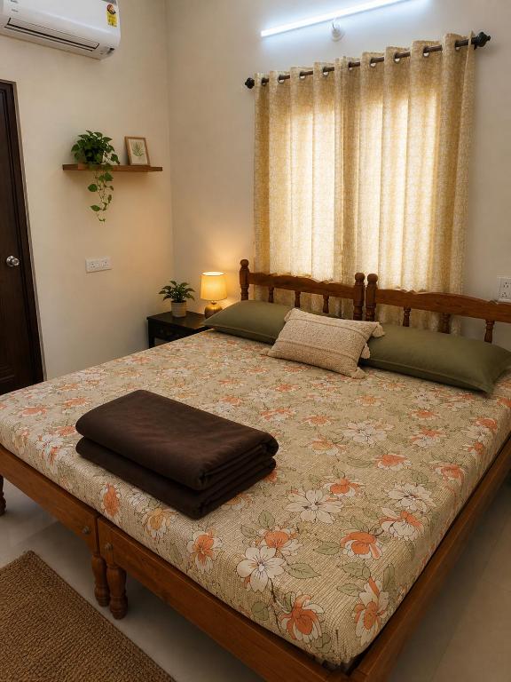 a bedroom with a large bed in a room at Coconut Inn - Parra Goa in Mapusa