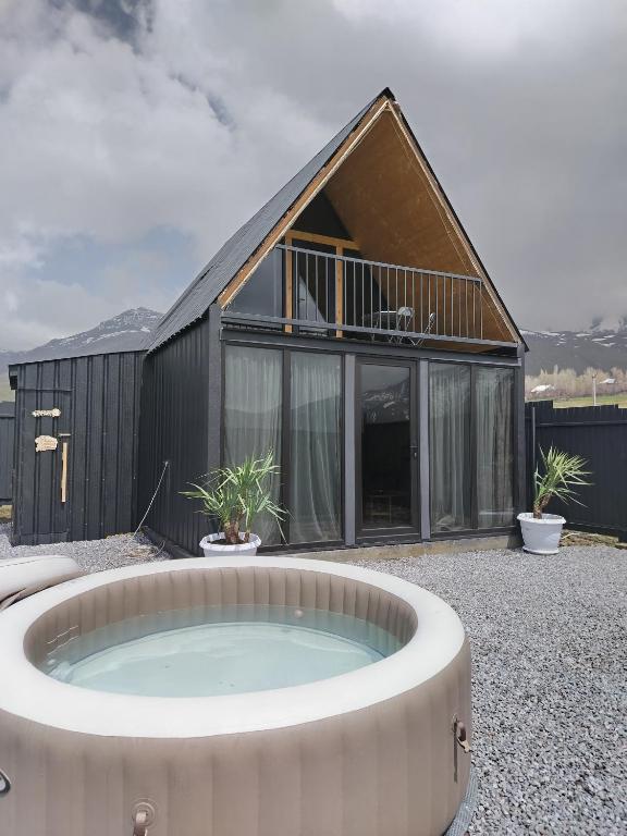 a house with a hot tub in front of it at APARAN House in Aparan