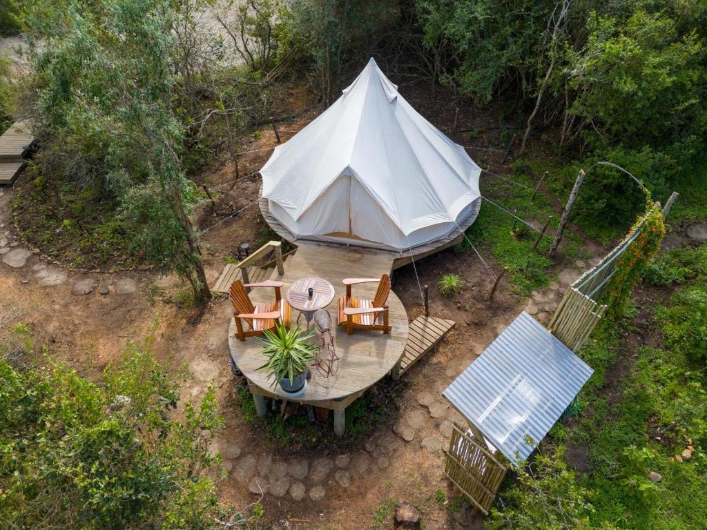an overhead view of a tent with a table and chairs at Zen Valley Glamping in Plettenberg Bay