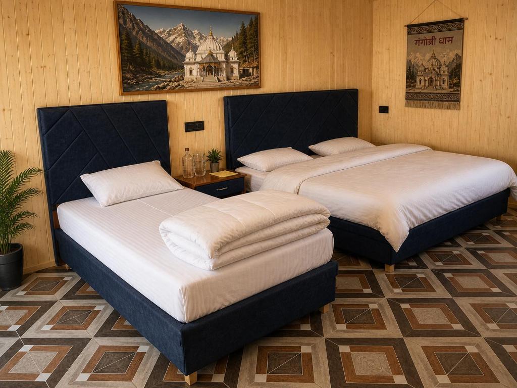 two beds sitting in a room with at Harshil Pinewood Homestay in Harsil